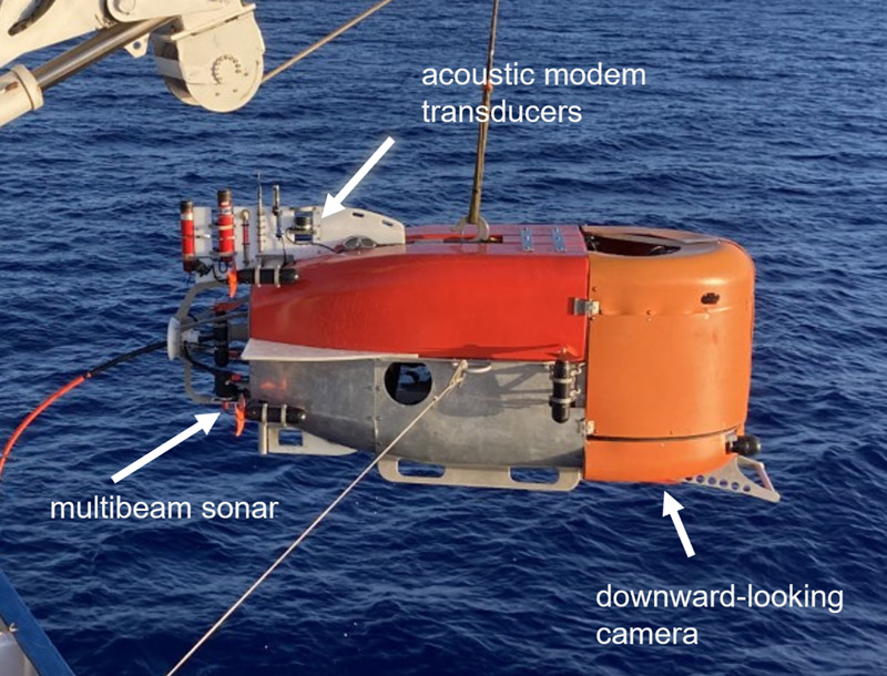 The hybrid remotely operated vehicle (HROV) Nereid Under-Ice (NUI) as configured for June 2022 operations near the coast of Hawaii. The annotations indicate sensors and acoustic communications equipment used to demonstrate aspects of CoEx.