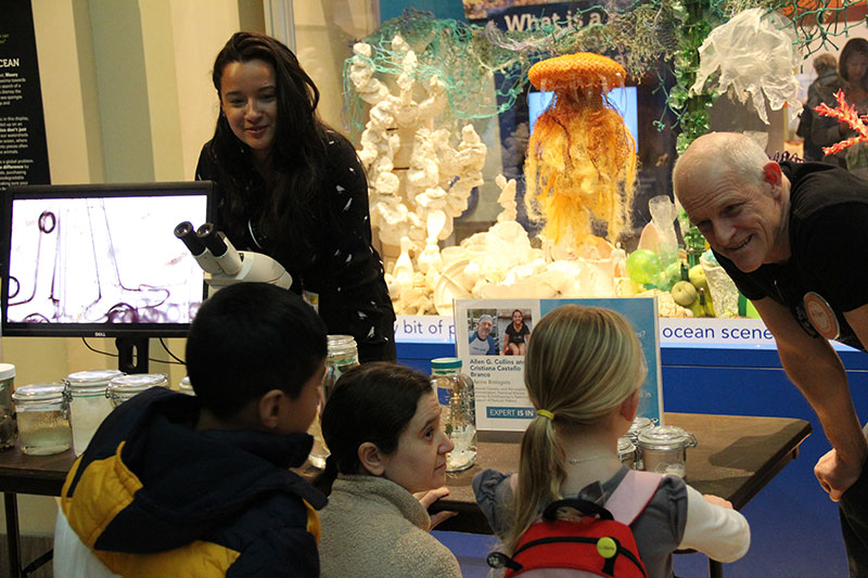 Cristiana Castello Branco and Allen Collins showcasing specimens collected during NOAA Ocean Exploration expeditions on NOAA Ship Okeanos Explorer for a “Scientist Is In” outreach event in the Sant Ocean Hall at the National Museum of Natural History.