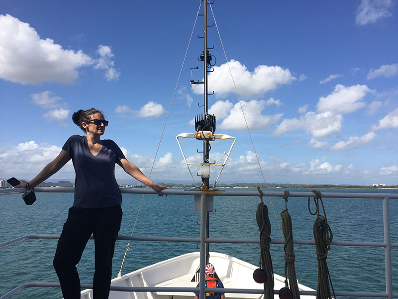 Chief scientist Andrea Quattrini on the bow of NOAA Ship Nancy Foster during the Illuminating Biodiversity in Deep Waters of Puerto Rico 2022 expedition.