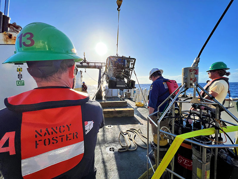 The NOAA Ship Nancy Foster crew and expedition science crew work together to bring remotely operated vehicle Global Explorer back on deck after a successful Illuminating Biodiversity in Deep Waters of Puerto Rico 2022 expedition dive.