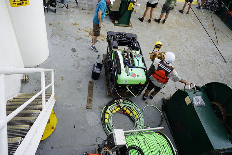 A view of a remotely operated vehicle (ROV) from the Marine Applied Research and Exploration (MARE) on the deck of Research Vessel Kilo Moana during the Deepwater Surveys of World War II U.S. Cultural Assets in the Saipan Channel expedition. The ROV is equipped with video and still cameras and can go to depths over 600 meters (1,970 feet). The ROV will collect imagery at the locations of anomalies found in the side-scan sonar data collected by the REMUS 600 vehicles being used during the expedition. The imagery helps researchers identify the anomalies and can be used to produce 3D models and orthomosaics of any cultural artifacts found during the expedition, preserving them in their current state and allowing for further study and documentation.