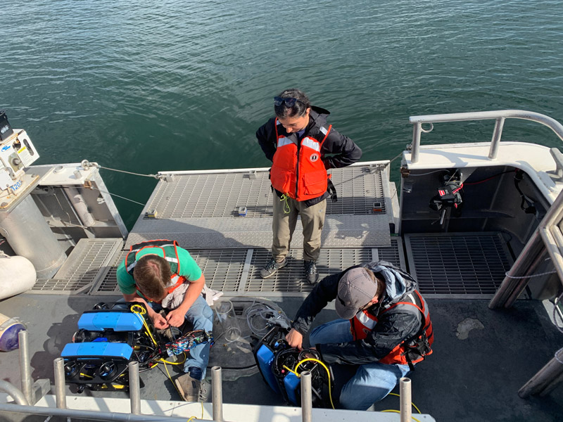 Co-principal investigator Corina Barbalata and her team from Louisiana State University are ready to deploy autonomous underwater vehicle Dory and remotely operated vehicle Nemo for field testing on Research Vessel Storm in Thunder Bay National Marine Sanctuary for the Machine Learning for Automated Detection of Shipwreck Sites from Large Area Robotic Surveys expedition.