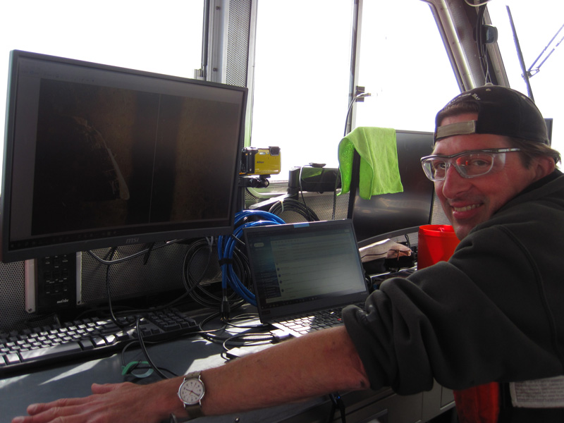 Chris Pinnow, Michigan Technological University marine technician, planning a new mission for  autonomous underwater vehicle Iver 3 during the Machine Learning for Automated Detection of Shipwreck Sites from Large Area Robotic Surveys expedition.