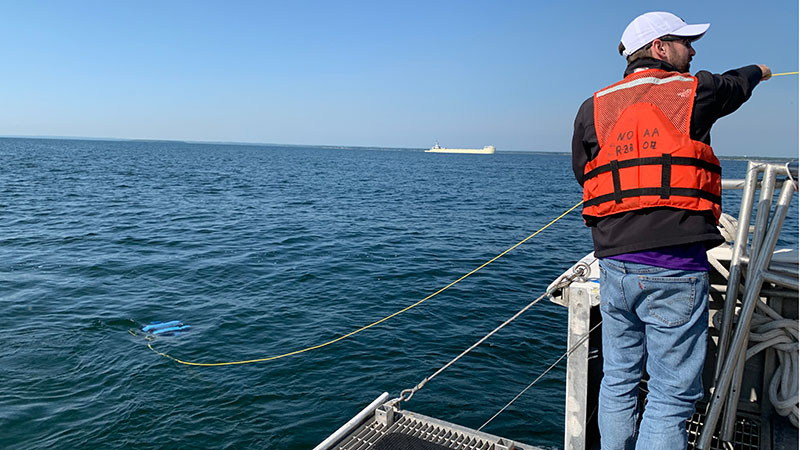 Figure 4: AUV Dory is deployed from R/V Storm for an autonomous shipwreck survey. 
