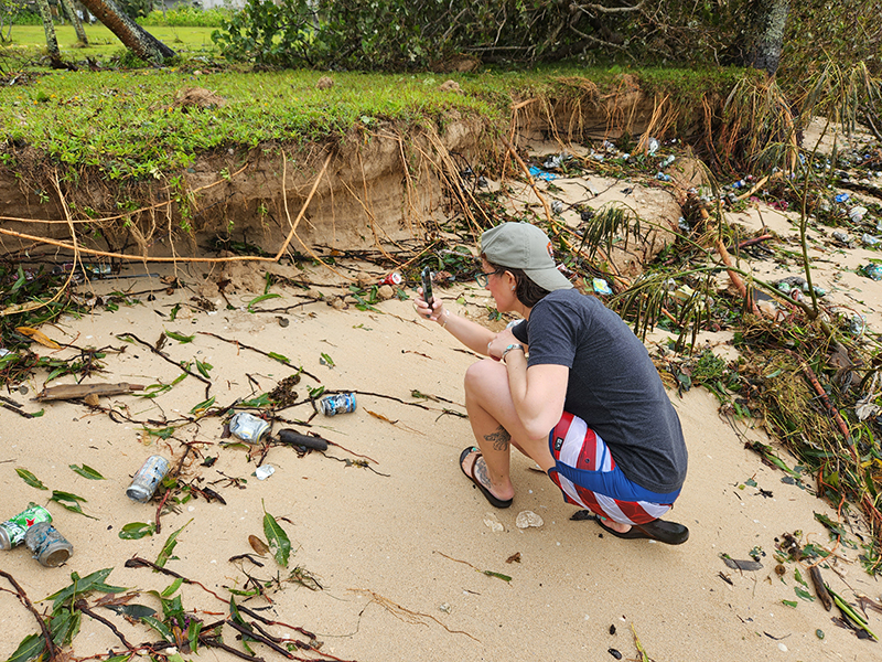 A project team member documenting bank undercutting and erosion along the shoreline at the Agat unit of Guam’s War in the Pacific National Historical Park immediately after Typhoon Mawar.