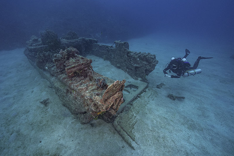 Anne Wright diving on an Amtrac amphibious tractor as part of an effort to generate high-resolution, in-depth documentation of this important cultural resource, one of the few currently known underwater relics from the 1944 invasion of Guam.