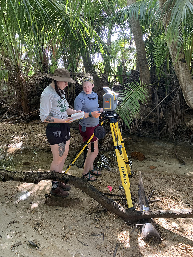 Julia Young and Liza Hasan, from the National Park Service’s Volunteers-in-Parks Program, conducting coastal elevation studies at Agat Beach to understand how war-related impacts to the reef may be affecting coastal vulnerability to natural hazards like storms and sea-level rise.