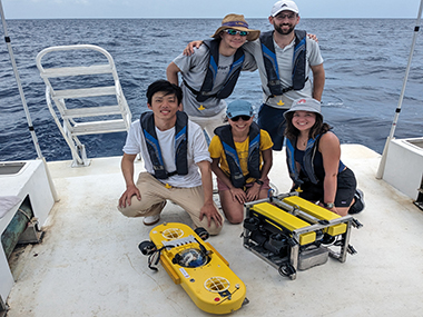 Team Members with Underwater Vehicles