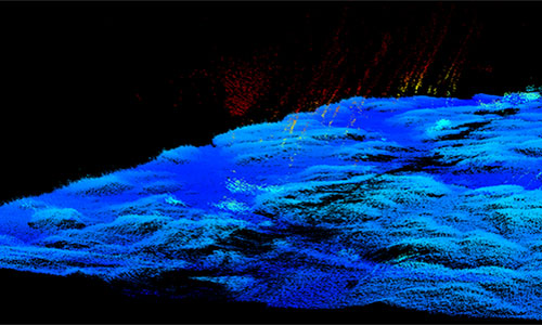 Abstract blue and yellow textured landscape against a black background.