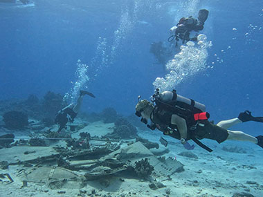 Jennifer McKinnon, a researcher with Ships of Discovery and a maritime studies professor at East Carolina University, is the principal investigator of Exploring Deepwater World War II Battlefields in the Pacific Using Emerging Technologies. Here, she introduces the project and its purpose and all the expertise that’s called upon to execute it.