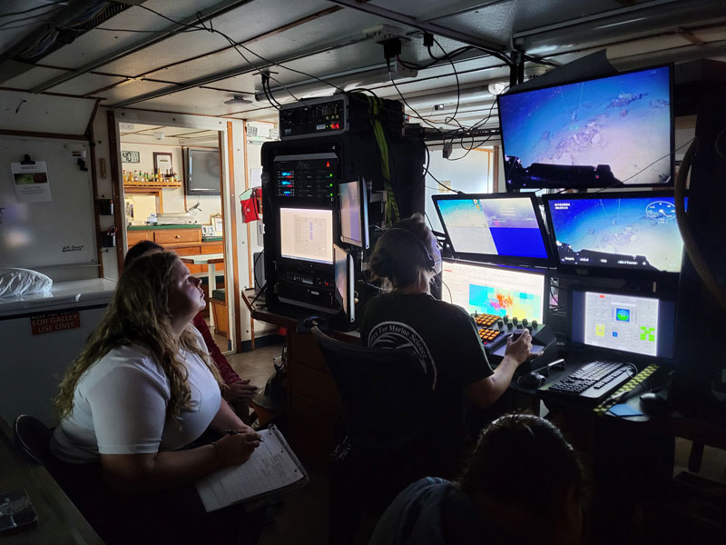 Researchers in the control room on Research Vessel F.G. Walton Smith monitor a dive during Exploration of Deepwater Habitats off Puerto Rico and the U.S. Virgin Islands for Biotechnology Potential, searching for interesting or unusual sponges and corals.