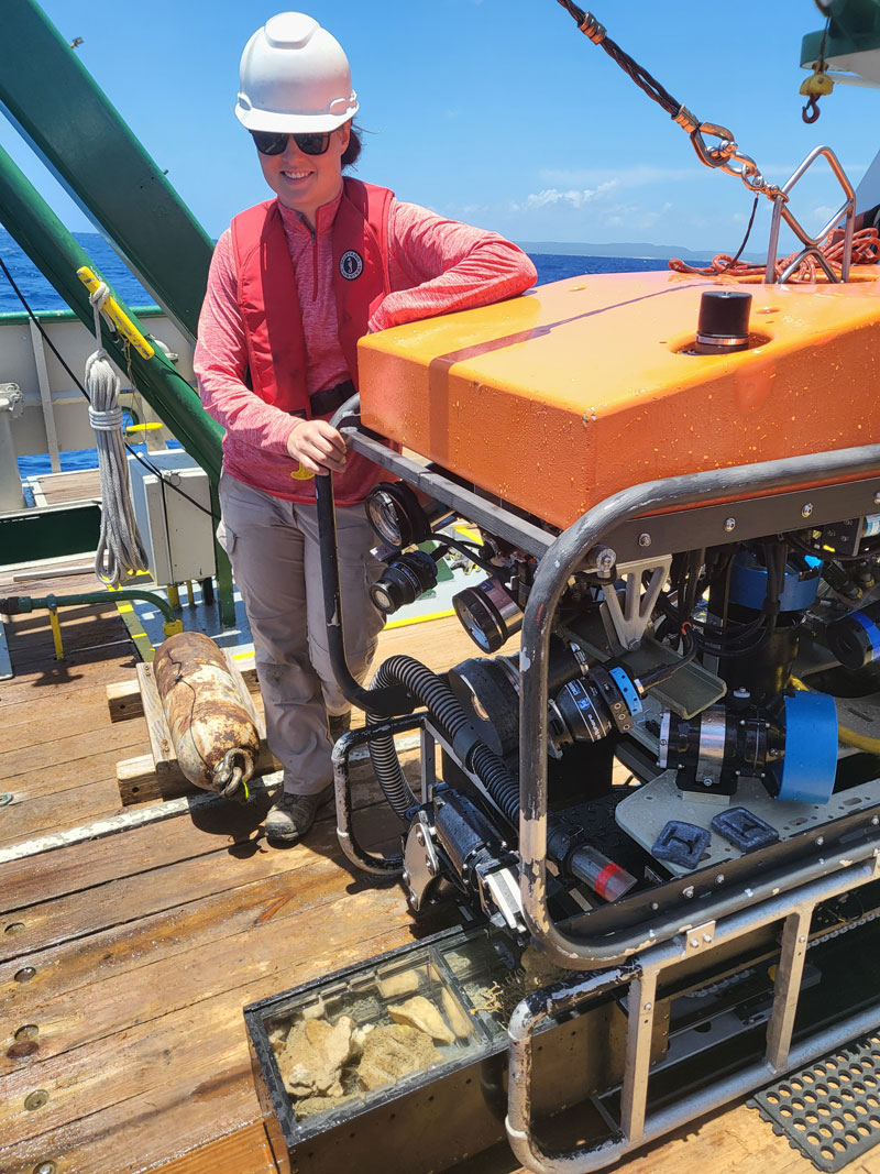 Madison Lytle with the remotely operated vehicle (ROV) crew on the deck of Research Vessel F.G. Walton Smith with the Mohawk ROV and full bioboxes during Exploration of Deepwater Habitats off Puerto Rico and the U.S. Virgin Islands for Biotechnology Potential.
