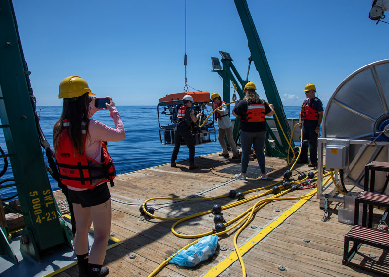 Courtney Brooks records the launching of the Mohawk remotely operated vehicle.