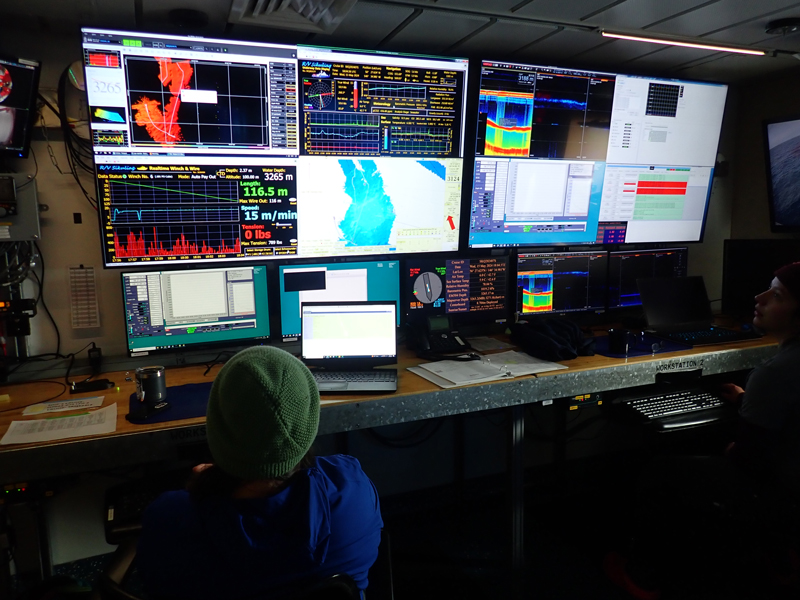 Alex Poje monitors the Multiple Opening/Closing Net and Environmental Sensing System (MOCNESS) and triggers the nets to open/close based on the sampling depth scheme.