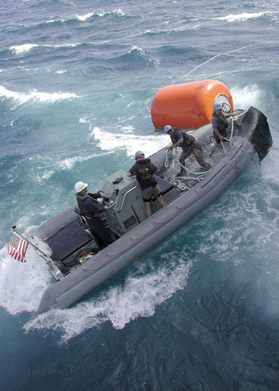 crew in rigid inflatable boat in heavy seas