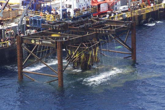 Engine being lifted to barge