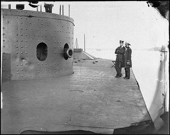 Officers standing by turret