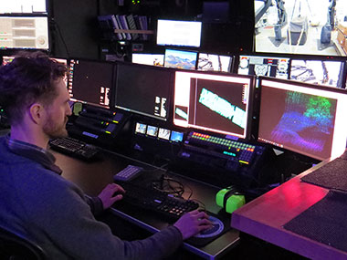 Mapping watchstander Cameron Kuhle, an Explorer-in-Training on the Seascape Alaska 1: Aleutians Deepwater Mapping expedition, "cleans" multibeam sonar data to ensure consistency and accuracy.