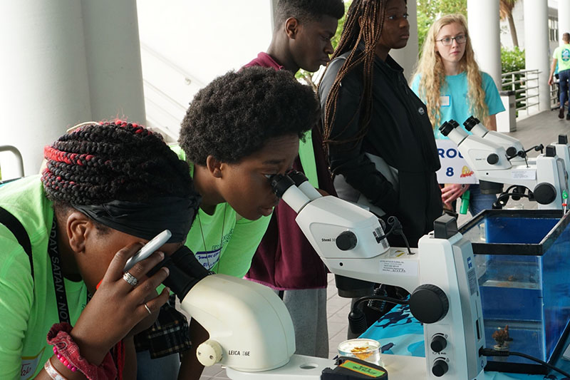 The “Marine World Magnified” and “Fintastic Faces” stations featured microscopes for students to examine the intricate skeletons of coral and the larval form of many local fish species. Students were then challenged to match the larval form to the adult fish in a game of “what will I become?”