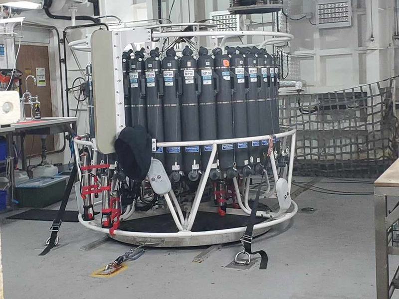 The CTD (conductivity, temperature, and depth) rosette on the deck of Research Vessel Investigator. A CTD is an important tool for measuring chemical and physical properties of the water column. CTD data are also important in acquiring sound velocity profiles of the water column to apply to multibeam sonar or other sonar data for accuracy of bathymetry measurements.