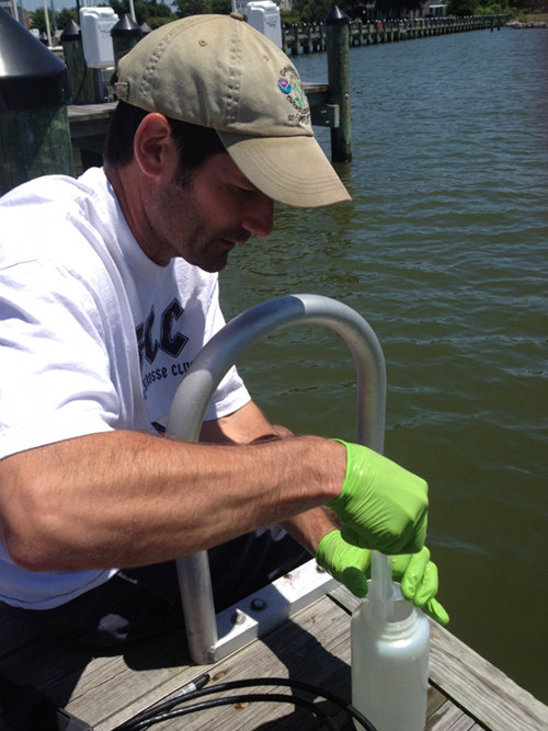 Dr. John Jacobs (NCCOS NOS) sampling the Chesapeake Bay site during the OSD summer 2013 pilot project.