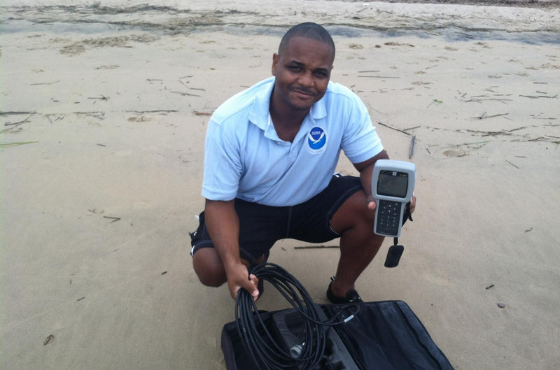 Delaware Bay site, Delaware: Lonnie Gonsalves preparing to take environmental data at the water sampling site.