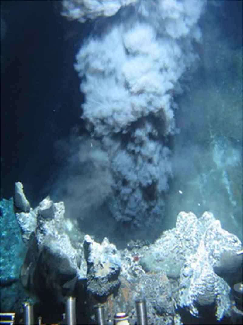 Black smoker vent in the High-Rise Field, Endeavour segment, Juan de Fuca Ridge. Metals and hydrogen sulfide combine to form dark sulfide minerals when hot fluids mix with seawater.