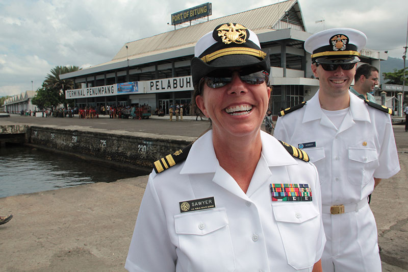 Medical Officer Robin Sawyer flashes a big smile before the June 23 Welcoming Ceremony begins.