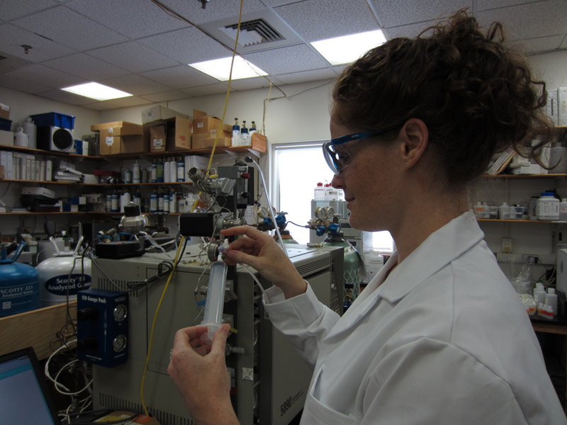 Jill McDermott, PhD student at WHOI, uses the gas chromatograph.