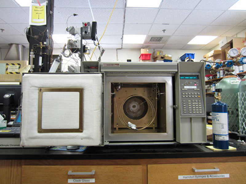 A sample has just been injected into the gas chromatograph using the syringe.