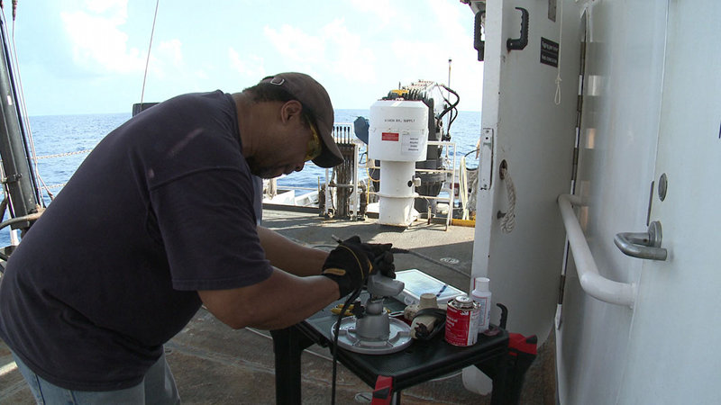 A termination failure occurred on the CTD rosette last night, ending the tow-yo early. Here, Chief Electronics Technician Richard Conway reterminates the wire.