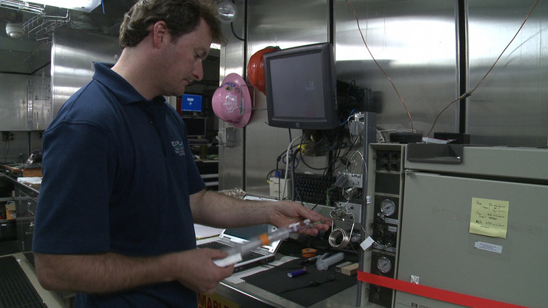 Dr. Cameron McIntyre processes water samples collected during the CTD tow-yo through the gas chromatograph to search for the presence of dissolved methane.