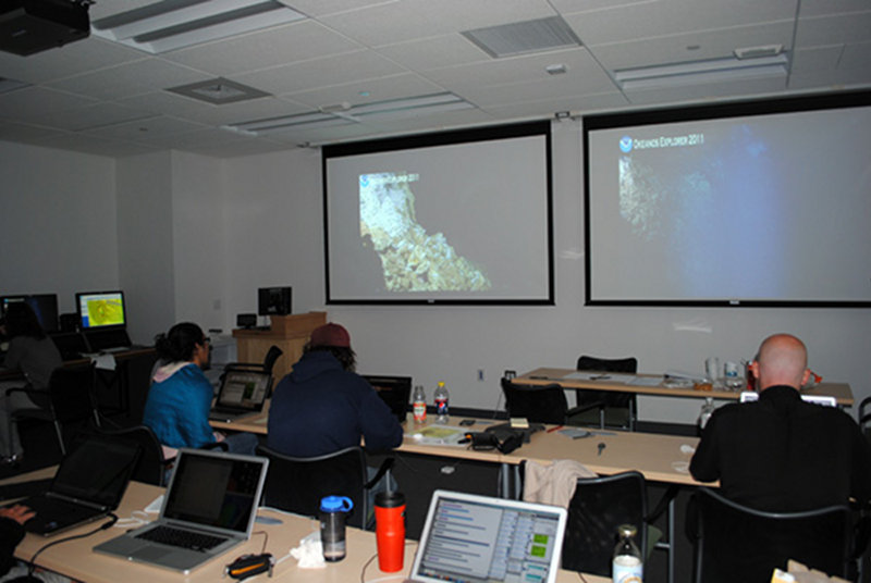 Team Rhode Island in the Exploration Command Center watching video streaming from NOAA Ship Okeanos Explorer at the Mid-Cayman Rise.