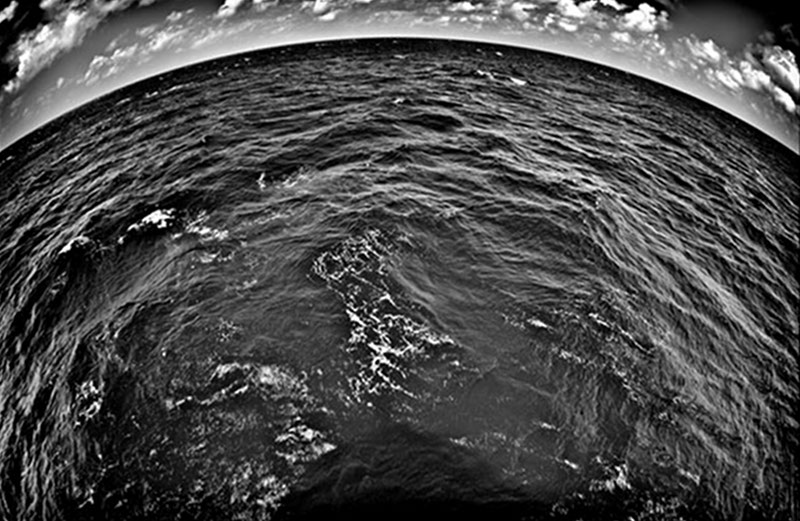 Specially processed black and white image of the ocean and horizon.