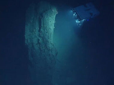 ROV D2 inspecting a large block of mudstone displaced from the wall of Heezen Canyon.