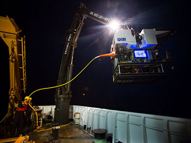 Members of the ROV team recover Deep Discoverer after a dive.