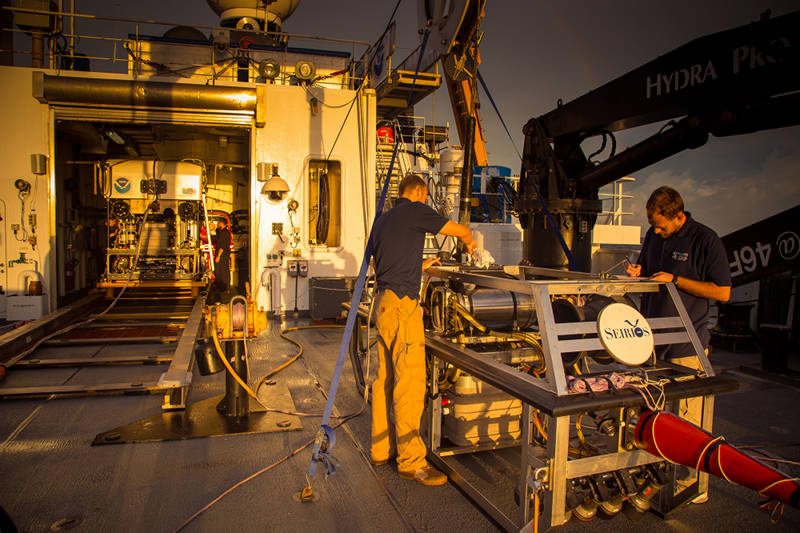 ROV team members take advantage of a small window of decent weather to do maintenance on Camera Platform Seirios.