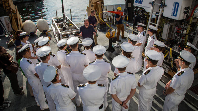 Okeanos Explorer ROV team lead, Dave Lovalvo, describes ROV operations and the mechanics of the vehicles to a group of US Naval Academy ocean engineering students.