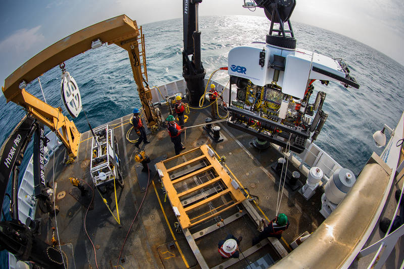 Okeanos Explorer's dual-body ROV system is loaded from the aftdeck of the ship into the water before conducting an exploration dive. 