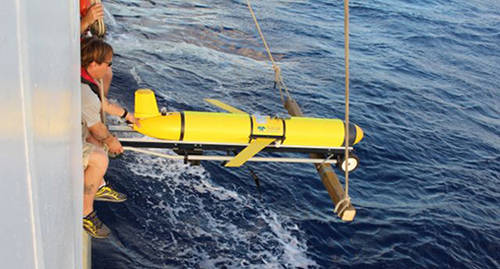 The Slocum Glider is deployed from NOAA Ship <em>Okeanos Explorer</em>  in early March.