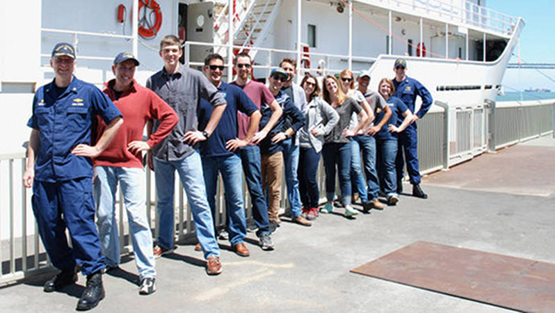 The mission team, joined by the Commanding and Executive Officers, alongside NOAA Ship Okeanos Explorer in San Francisco, CA.