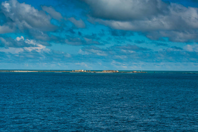 Tern Island, part of French Frigate Shoals, was formed into a runway to serve as a refueling stop for planes en route to Midway during World War II. Some of the buildings, runway, and the original seawall still remain.