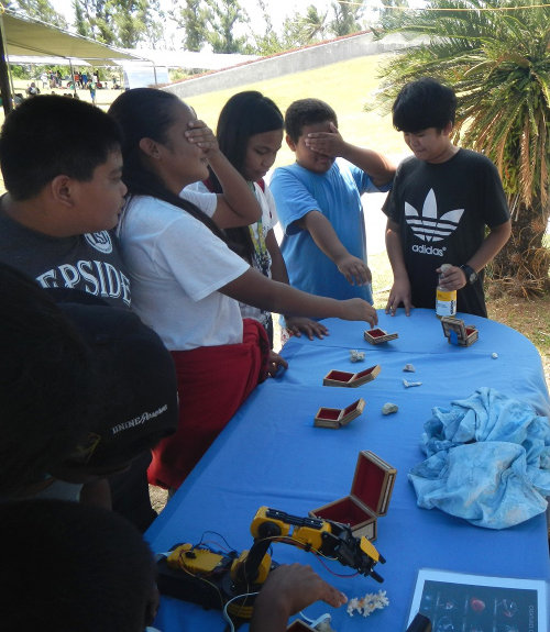 Students who didn’t use the robotic arm worked in pairs to collect their own samples.