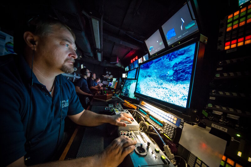 Roland Brian adjusts the camera focus of the main ROV HD camera during a dive.