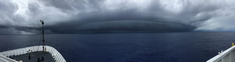 The second squall line approaches the Okeanos Explorer just before the ROVs reach the bottom.