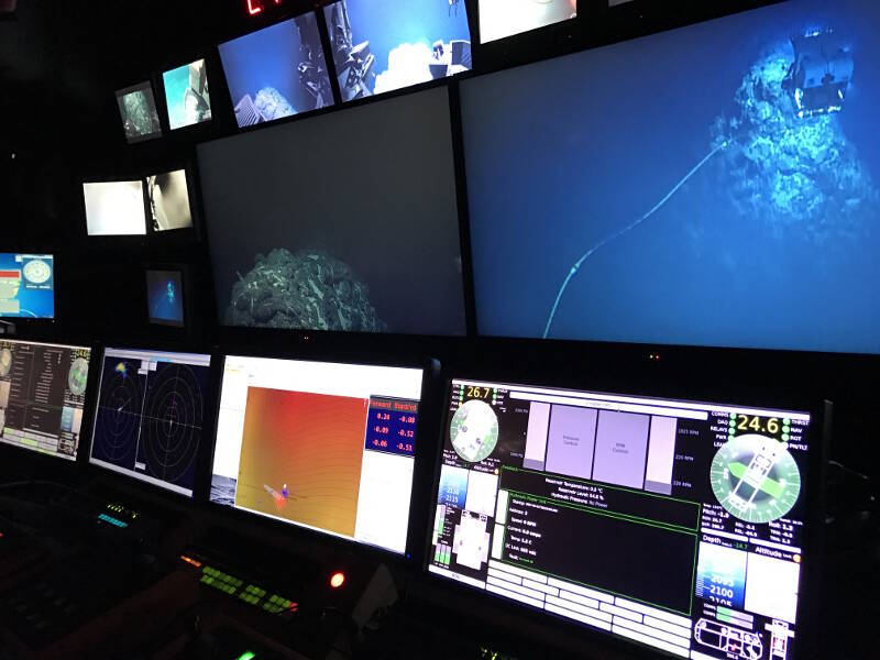 Pilot displays showing orientation, depth, and distance from bottom of the ROVs; sonar from each; and their relative relation to the ship.