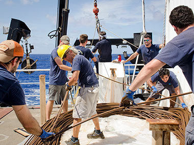 A short between the conductors in the .68 cable, located 2,850 meters (9,350 feet) up the cable, caused a power loss to the vehicles yesterday. The damage could not be repaired so the remotely operated vehicle team used the day to plan and spool the cable off the storage drum, manually lay roughly 2,900 meters (9,514 feet) of cable onto the deck and cut out the damaged section. The remaining cable was found to be in acceptable condition and will be re-terminated to continue operations.