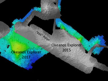 Map showing the bathymetry data acquired during our July 2017 cruise in the vicinity of “Keli” Ridge and “Edmondson” Seamount. Data collection efforts over several days were designed to complement previous data acquired by R/V Falkor in 2016 and Okeanos Explorer in 2015. Previously acquired datasets are shown as grayscale, and the data acquired this cruise is shown as color bathymetry. 