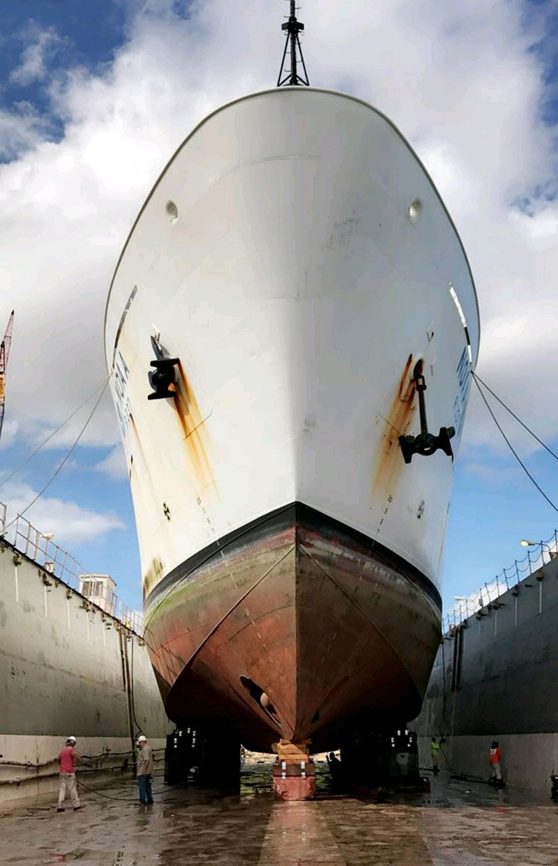 During dry dock, the Okeanos Explorer was raised out of the water so that maintenance crews and engineers could work on the hull of the ship. The hull of the ship was cleaned and painted, with crews taking care not to damage any underwater sensors mounted on the hull. These sensors help map the ocean and also help locate the remotely operated vehicles using transducers for underwater acoustic positioning.