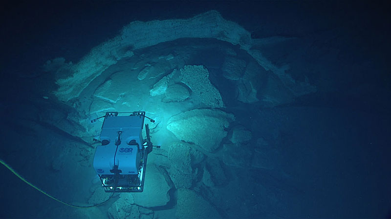 Remotely operated vehicle Deep Discoverer investigates some of the striking geology seen during the dive.